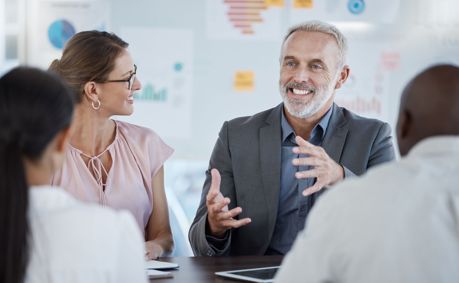Diversity, team and financial advisor in meeting have discussion, talking and planning for startup company, happy and in workplace. Business, teamwork and leadership collaboration, strategy or office